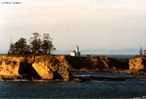 Distance shot of the lighthouse and cliffs.