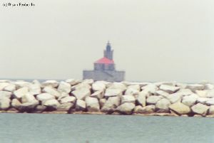 Somewhat blurry shot of the lighthouse out in the lake.