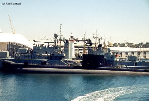 Cape Bowling Green light with a sub and destroyer in foreground.