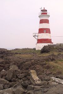 The tower and rocky cliff.