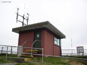 A lookout and weather station sits near the lighthouse.