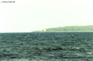 Extreme distance shot of the Charity Island Light.
