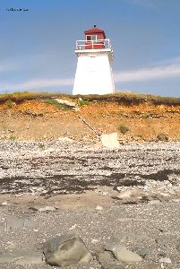 The rocky shore below the tower.
