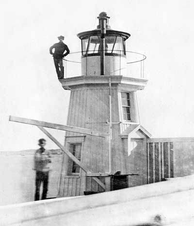 U.S. Coast Guard Archive Photo showing the 1855 wooden Portland Breakwater Lighthouse