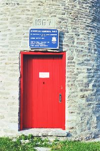 A close up of the plaque and door of the lighthouse.