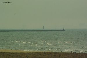 Two breakwater lighthouses mark piers.
