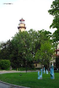 The lighthouse above the trees.
