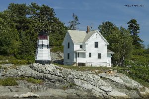 Close up photo of the Perkins Island Lighthouse and dwelling.