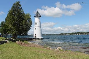 Lighthouse, tree, and river.