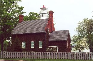 The tower peeks over the roofline of the quarters.