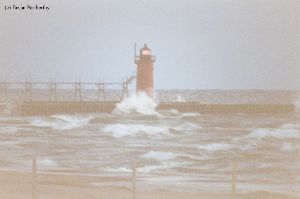 Waves crash against the breakwall at South Haven.