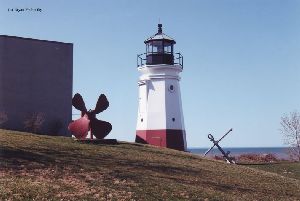 Lighthouse with propeller and anchor.